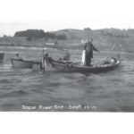 Photo # 289. Man on Boat Holding Salmon